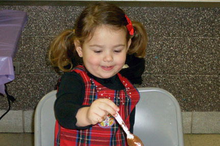 Little Girl with Chocolate Covered Spoon